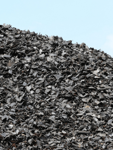 A pile of torn tyres against a light blue background. The image is divided into three parts—this is the right section.